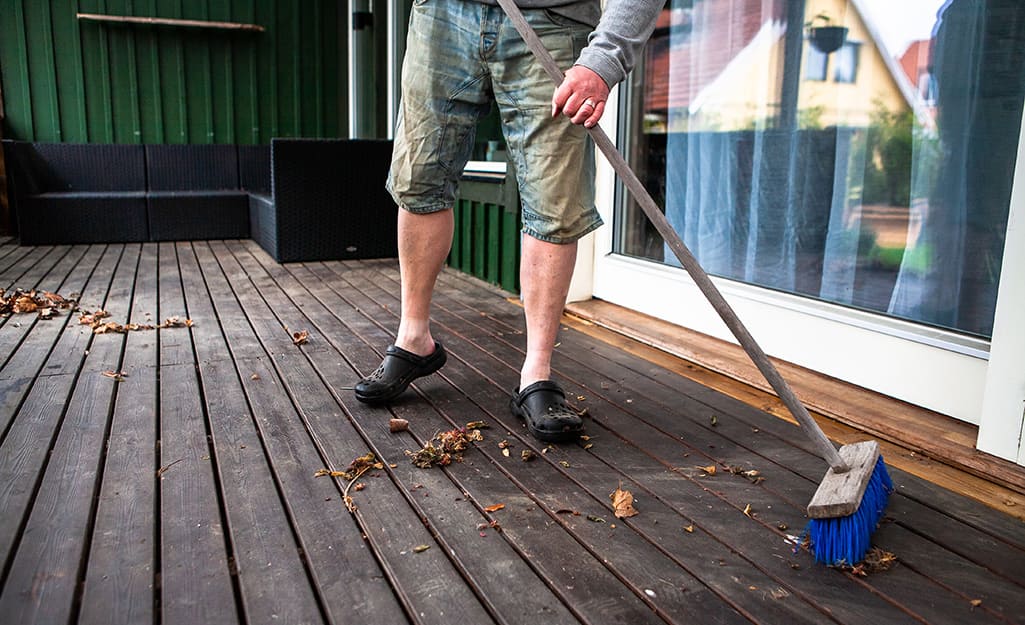 Mildew removal from a wooden deck